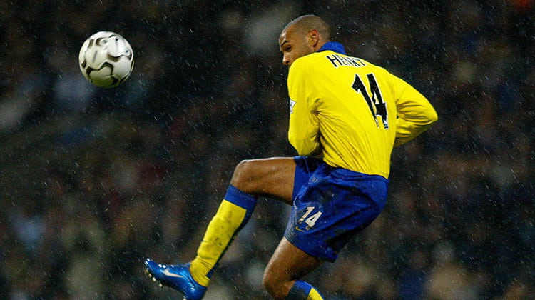 Thierry Henry wearing yellow Arsenal kit