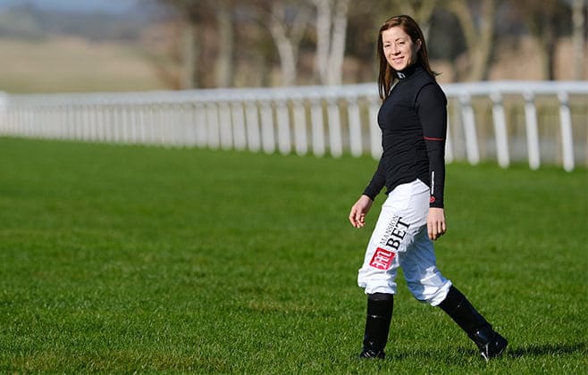 Jockey and horse racing expert Hayley Turner wears MansionBet branded riding gear