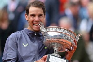 Rafael Nadal wins the French Open in 2019 and celebrates with the trophy