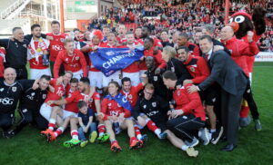 Bristol City players and coaches celebrate winning the second division