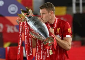 Liverpool captain holding the Premier League trophy