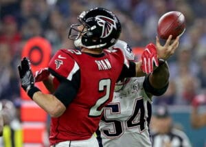 Matt Ryan of the Falcons is hit by a Patriots defender in Super Bowl LI