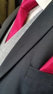 Close up of man's three-piece suit.