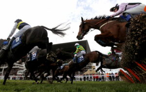 Barry Geraghty riding to Coral Cup Hurdle triumph
