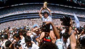 Diego Maradona holds aloft the 1986 World Cup Trophy