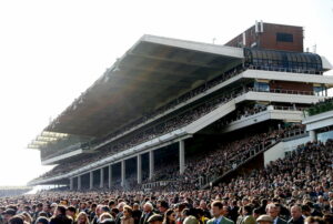 Crowds in the grandstands watching racing at Cheltenham