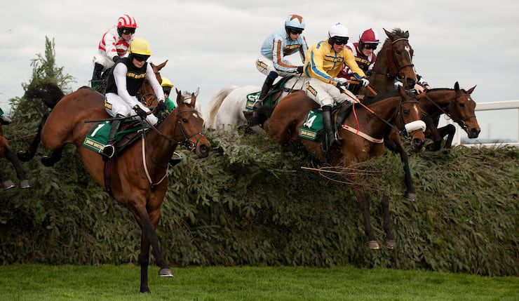 Nigel Twiston Davies rides to victory in the Foxhunter Steeple Chase