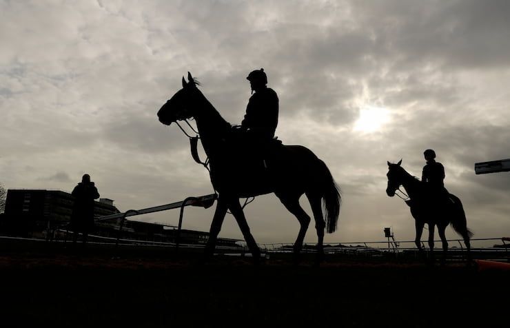 Silhouette of horses at start of Ladies Day, at the Aintree Grand National Festival