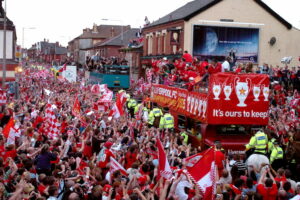 Liverpool team bus surrounded by fans after winning 2005 Champions League