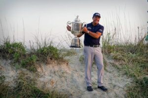 Phil Mickelson holding the 2021 PGA Championship trophy