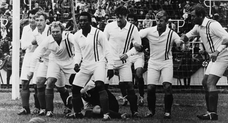 Pele and his cast of supporting footballers in 'Escape To Victory'