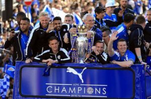 Leicester City players on an open top bus to celebrate winning the Premier League.