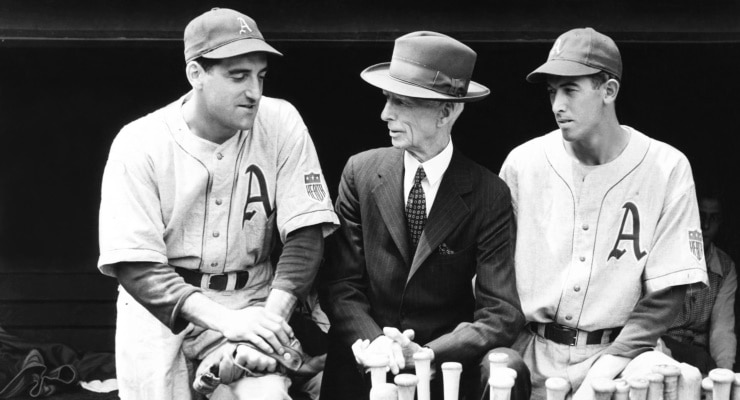 Connie Mack (centre) was in his 45th season as Philadelphia Athletics manager in their mammoth game in 1945