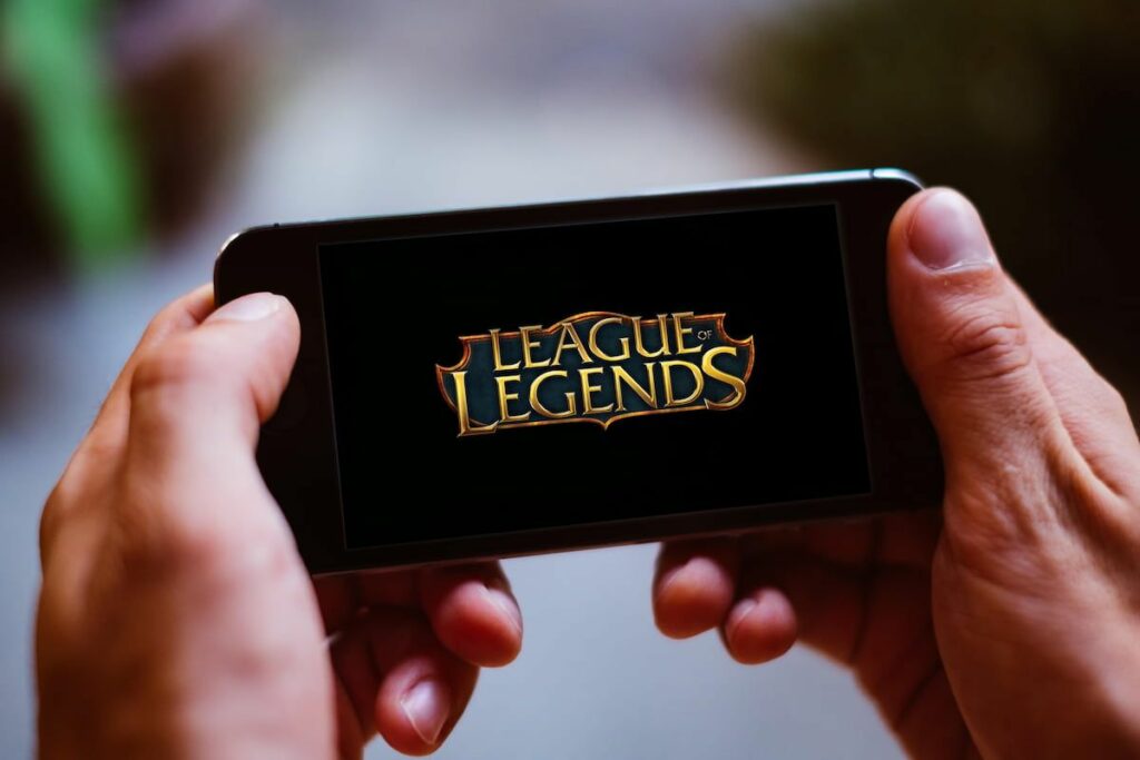 League of Legends title displayed on a mobile phone.