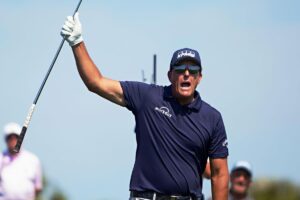 Golfer Phil Mickelson celebrates a good shot.