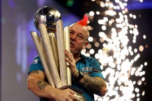 Peter Wright lifts the PDC Darts World Championship trophy.