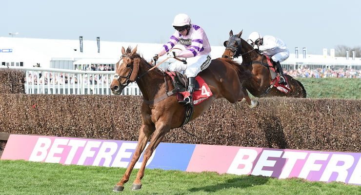 Horse and rider clear the final fence in the 2015 Bowl Steeple Chase at Aintree Racecourse.