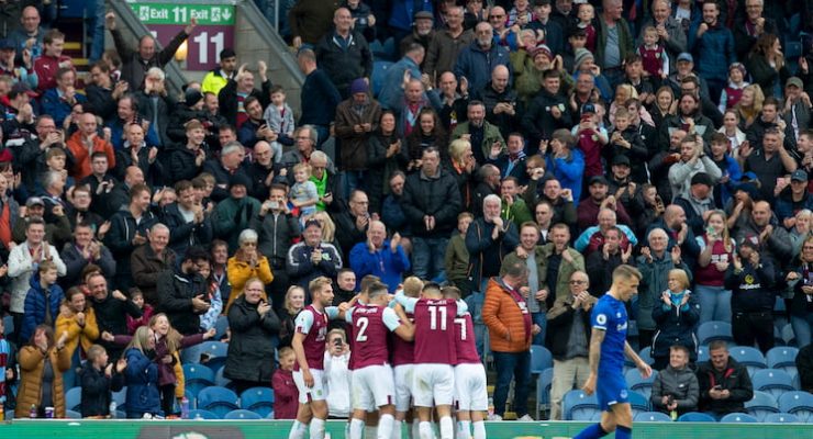 Burnley players celebrate a goal in front of their fans