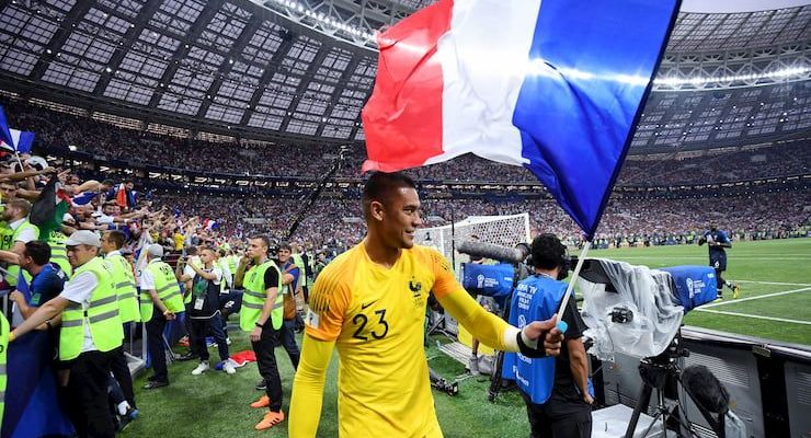 The French goalkeeper waves the tricolour after France win the World Cup.
