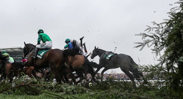 Horses jump a fence at the 2018 Topham Steeple Chase