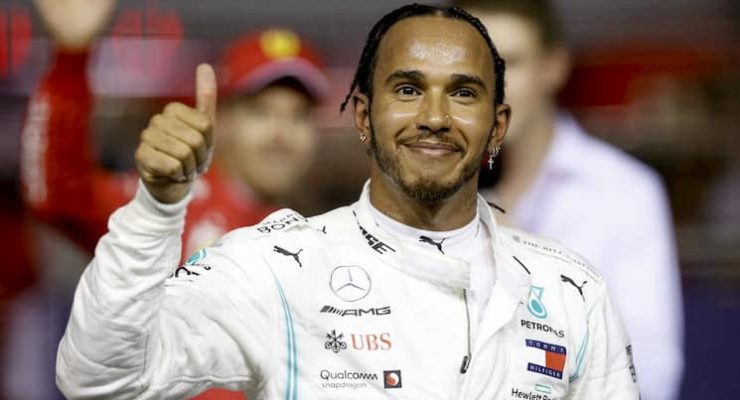 Lewis Hamilton gives the thumbs up after a race