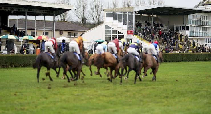Horses racing past the stand at the Mares' Novices' Hurdle